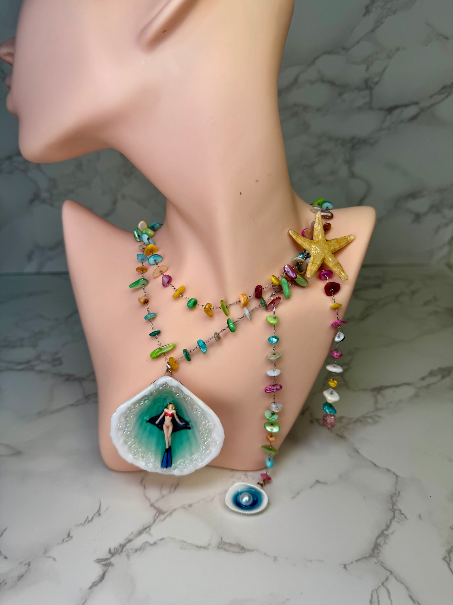 Rainbow Reef Explorer Natural seashell featuring a miniature scuba diver, manta ray, and tiny starfish Silver 925