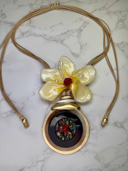 Sunlit Rose Tide Yellow flower with a miniature red rose center