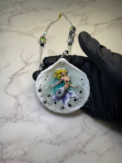 Lavender Tides Mermaid Natural seashell featuring a handmade crafted blonde mermaid with a white-and-purple shimmering tail encapsulated in clear UV resin Beauty Natural Necklace