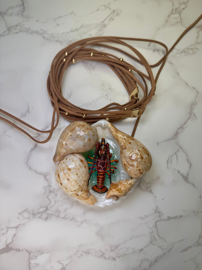 Coastal Lobster Haven Natural seashell centerpiece with a handmade craft metal  realistic lobster inside preserved in clear UV resin Beautiful long triple Fabric necklace