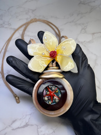 Sunlit Rose Tide Yellow flower with a miniature red rose center