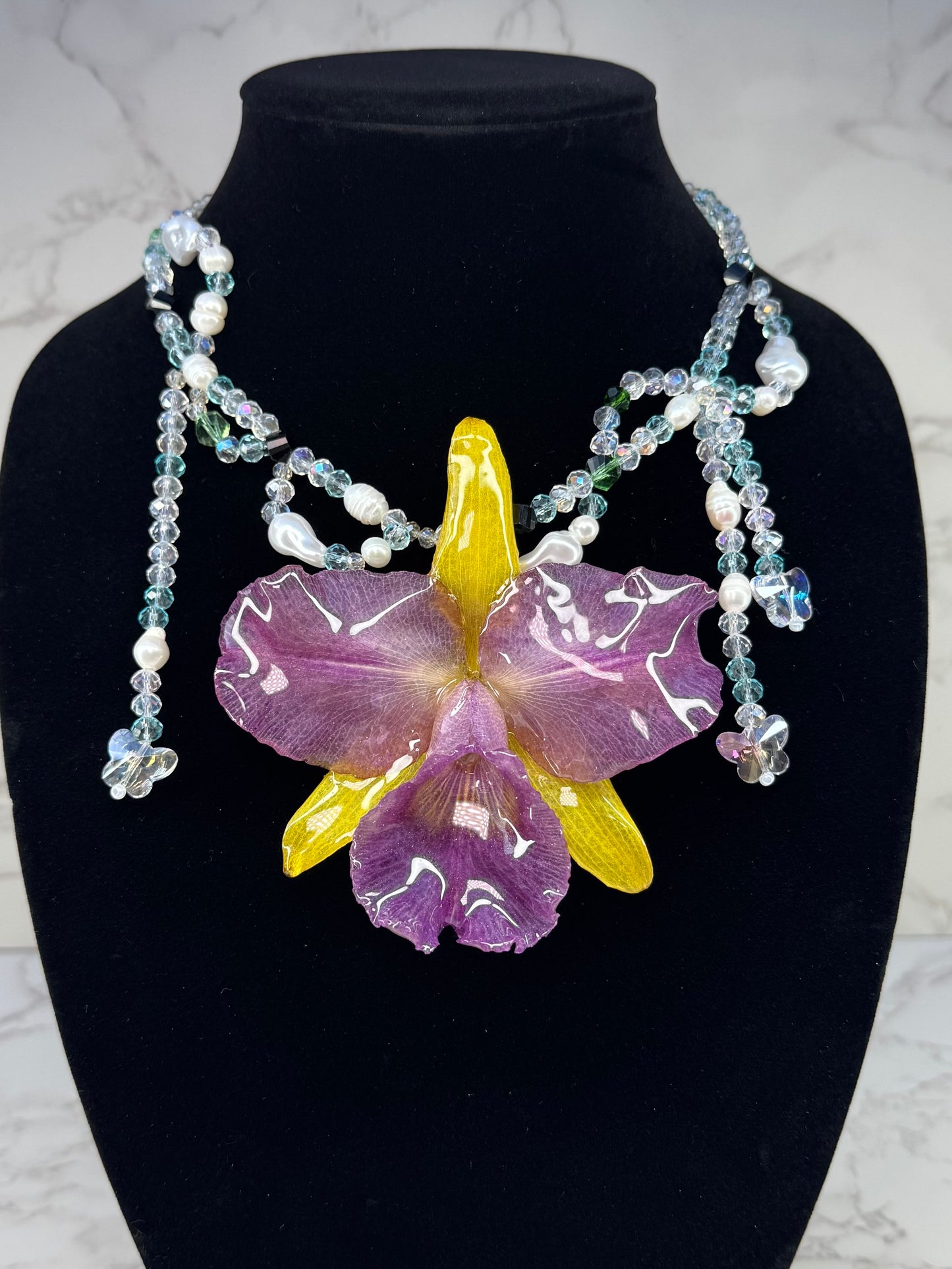 Oceanlight Cattleya Bloom Purple & Yellow Cattleya Orchid Necklace – Clear & Light Blue Crystal Beads