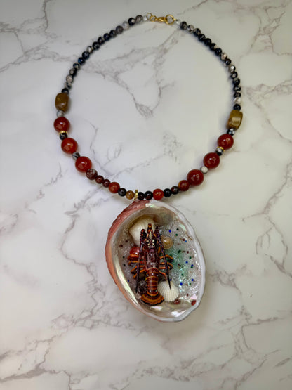 Scarlet Shore Vibrant red abalone seashell featuring a metal handmade craft realistic lobster, tiny natural shells, and a red crystal pendant encapsulated in clear UV resin Limited Edition