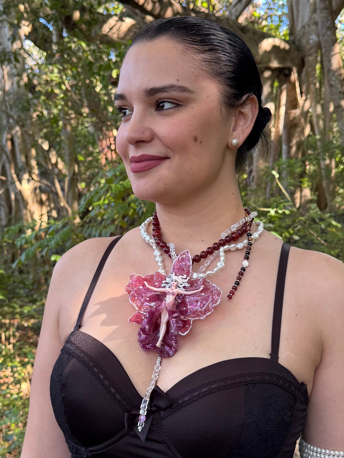 Calista – LIMITED EDITION – NYFW EXHIBITION PIECE Real Dark Purple Orchid with White Edges, Hand-Carved Female Figure, Mother-of-Pearl, Freshwater Pearls and Clear & Crimson Crystal Necklace