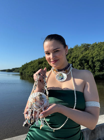 Aqualis – LIMITED EDITION – NYFW EXHIBITION PIECE Natural Seashell Art Necklace with Hand-Carved White-to-Purple Mermaid, Clear Crystals, Black Accents and Purple & Amber Crystal Necklace