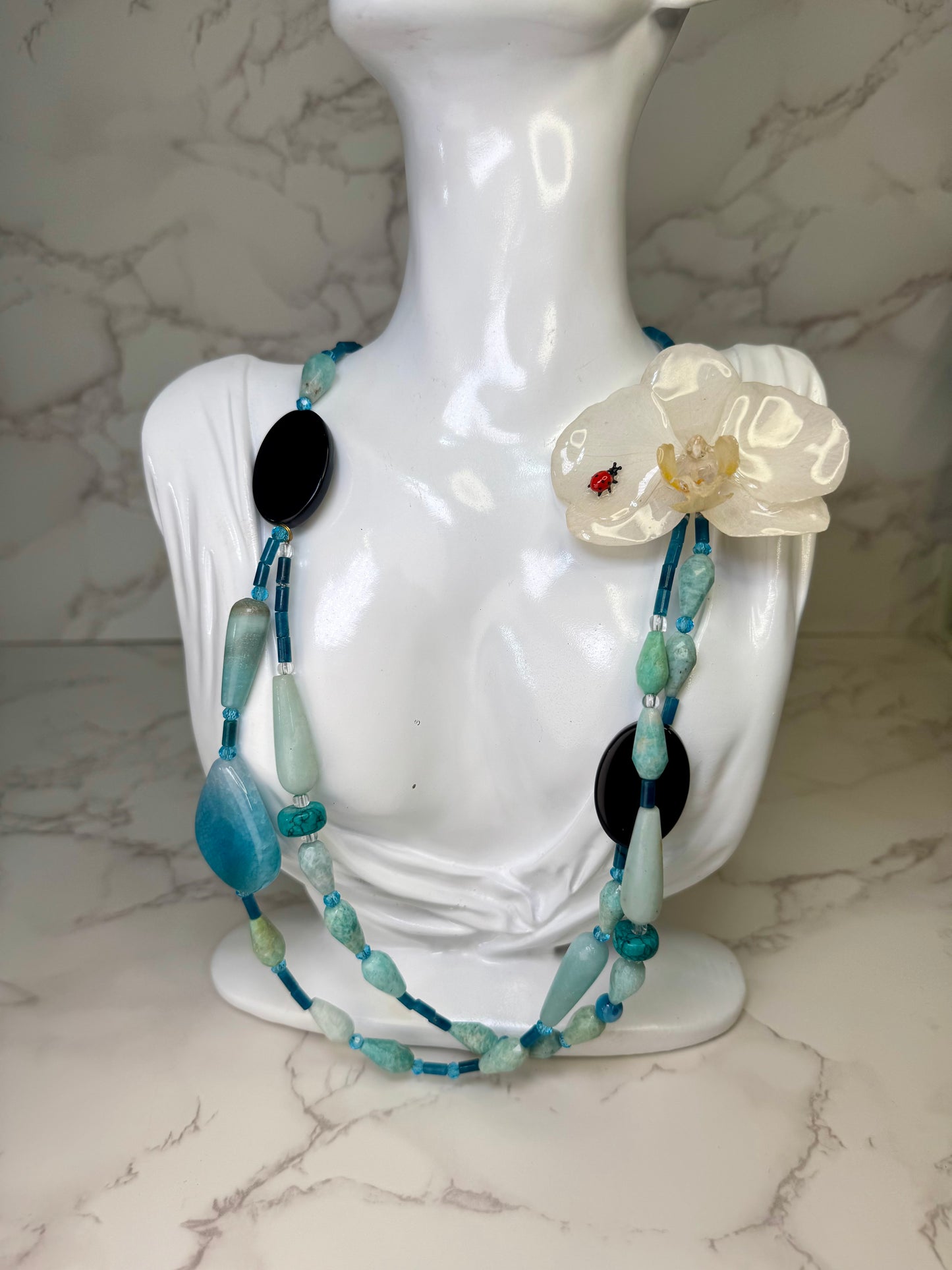 Snowpetal Ladybug Bloom Natural Flower Preserved in Resin White Real orchid flower centerpiece with a tiny red ladybug Natural Beautiful Stones Necklace