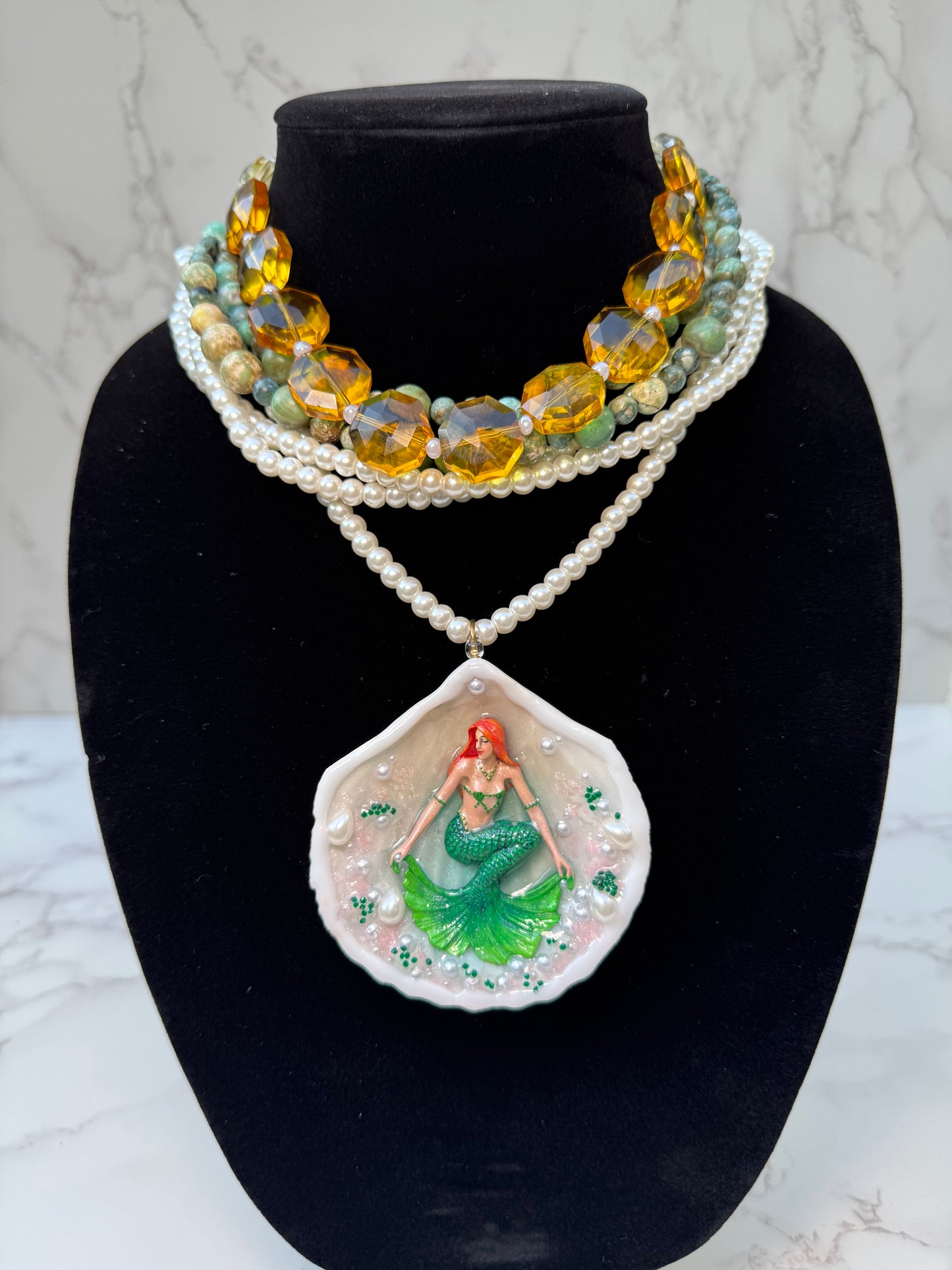 Caelara – LIMITED EDITION – NYFW EXHIBITION PIECE Natural Seashell Art Necklace with Hand-Carved Green Mermaid, Pearl and Crystal Details, Green and Amber Beaded Crystal Necklace
