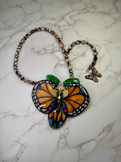 The Orange Wing – Orchid of the Whispering Leaf