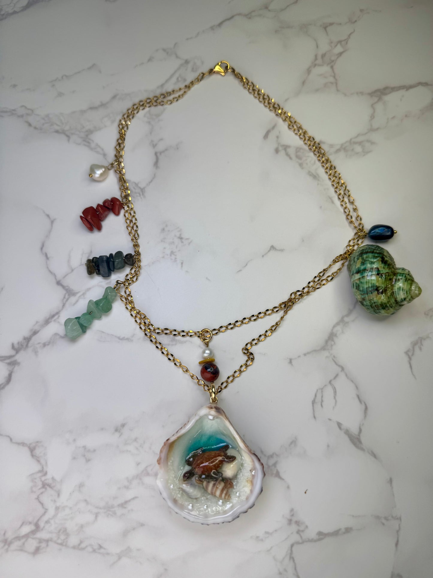 Emerald Tide Traveler Natural seashell with a miniature sea turtle inside